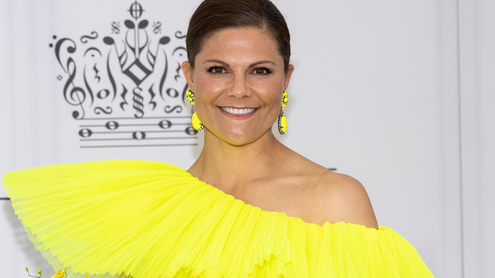 Crown Princess Victoria of Sweden in vibrant yellow dress
