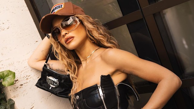 Rita Ora poses in a black leather zip dress on her Instagram