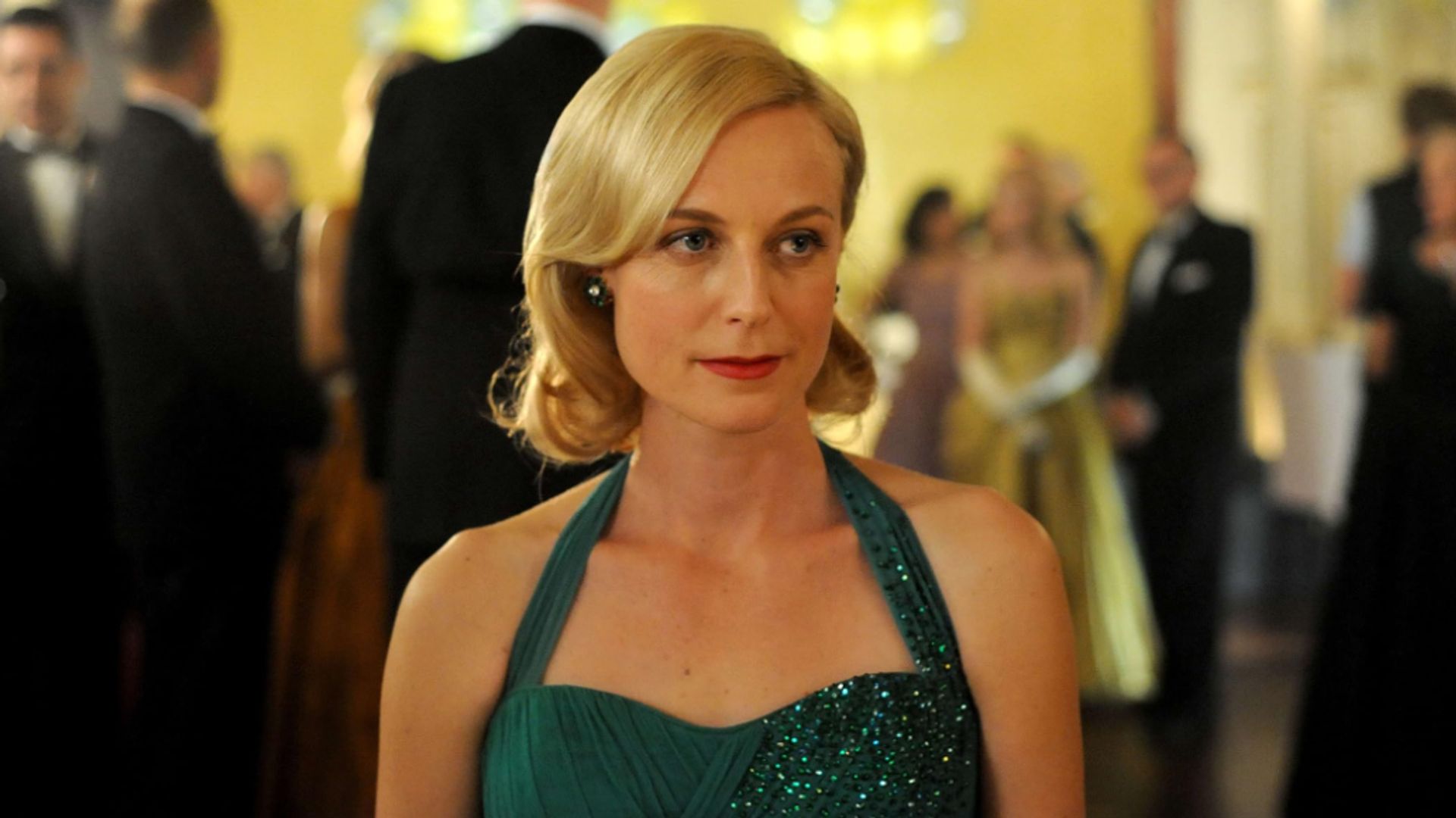 Marta Dusseldorp in a green dress in a scene from A Place to Call Home