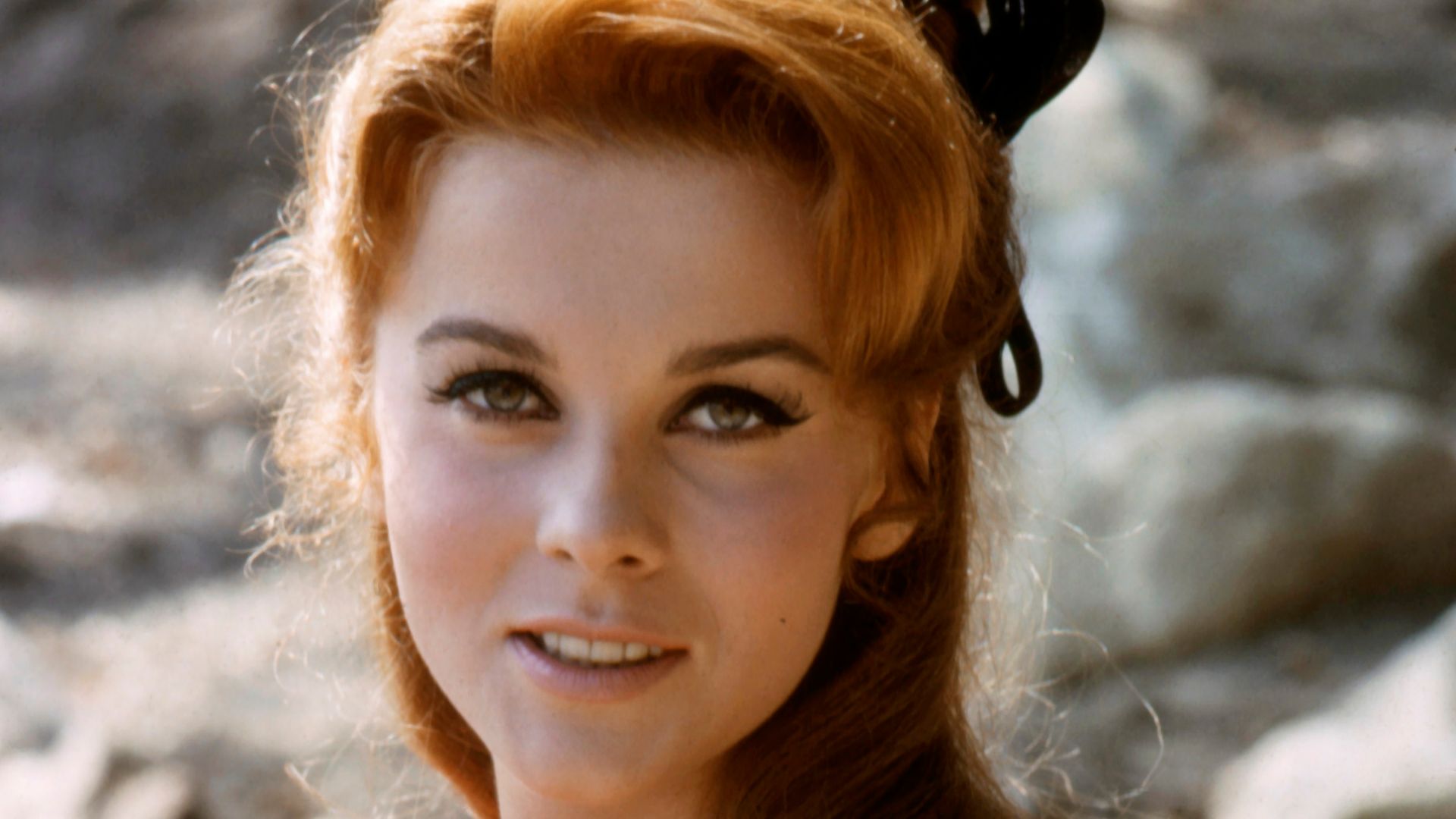 Ann-Margret smiling portrait in colorful dress circa 1965