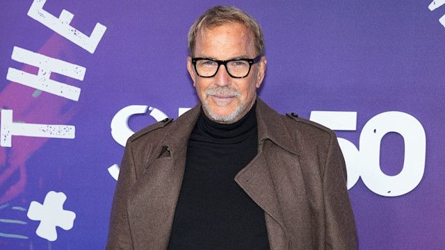 kevin costner with hands in pocket on red carpet