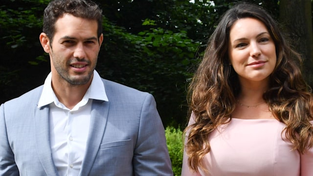 Kelly Brook in a pink dress and Jeremy Parisi in a blue suit