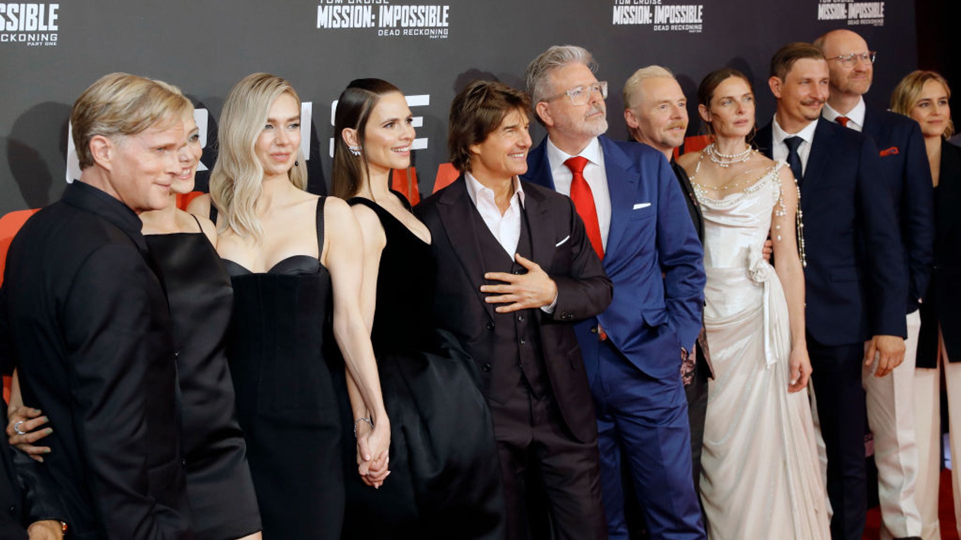 The complete cast of Mission Impossible 7 pose together on the red carpet. 