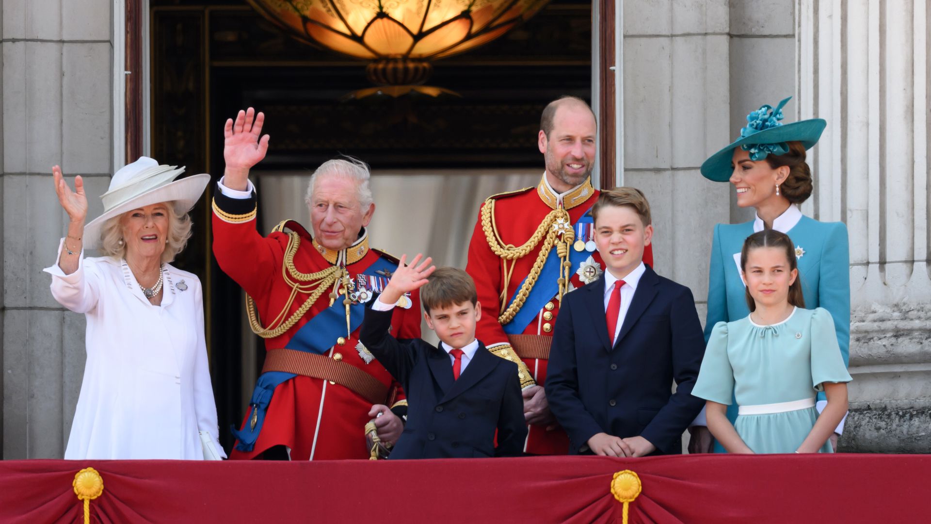 Queen Camilla, King Charles, Prince Louis, Prince William, Prince George, the Princess of Wales and Princess Charlotte on the balcony at Buckingham Palace