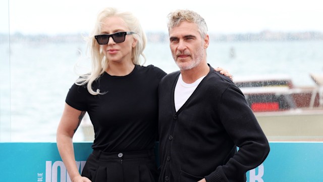 Lady Gaga with her arm on Joaquin Phoenix's shoulder