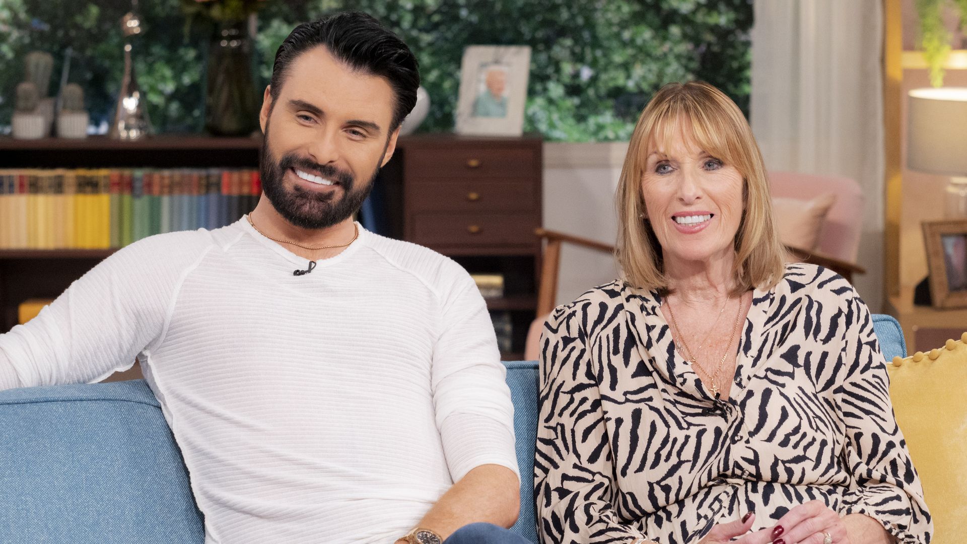 Rylan Clark and his mum sat on a sofa