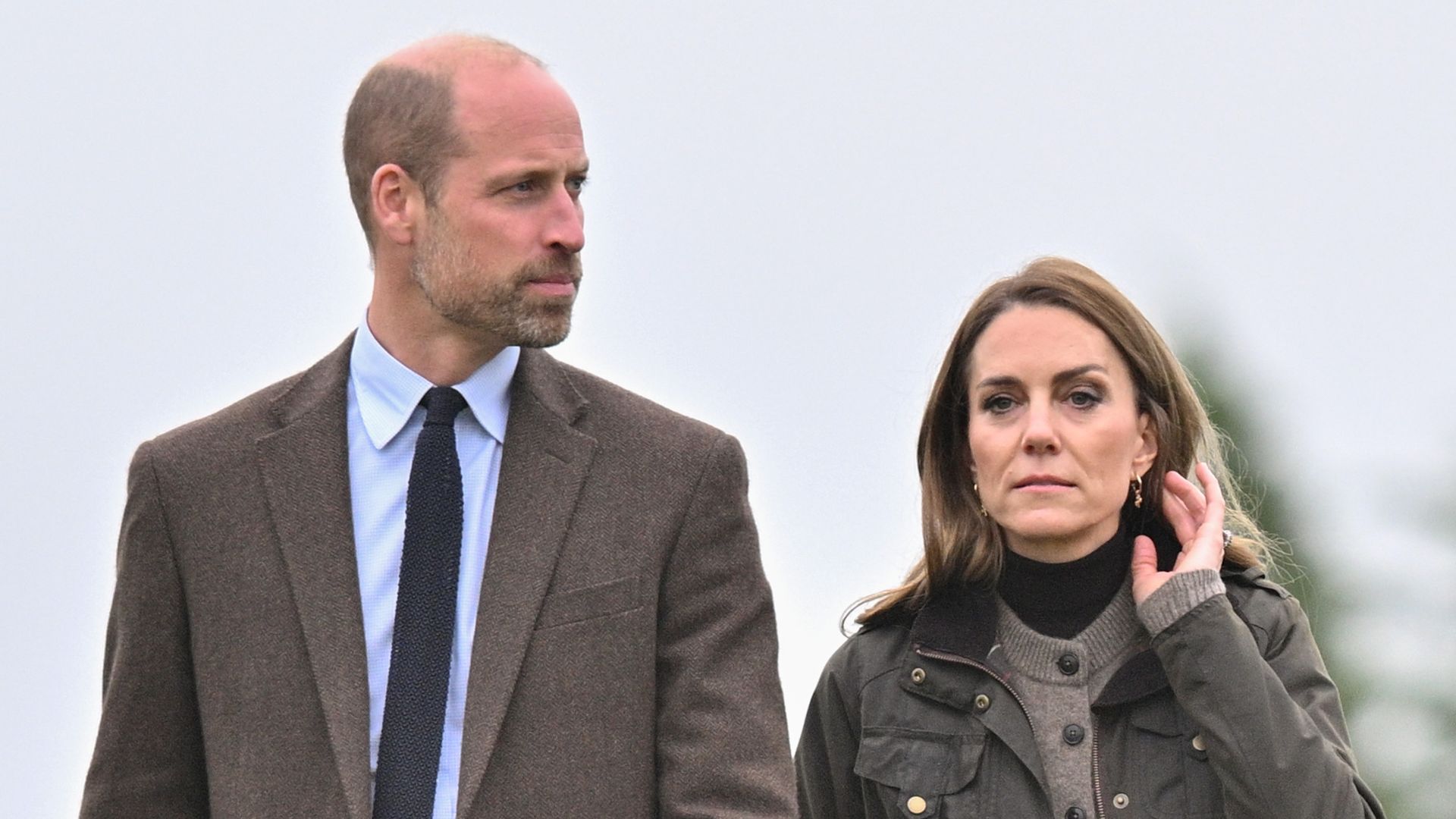 Prince William and Kate Middleton with sad expressions