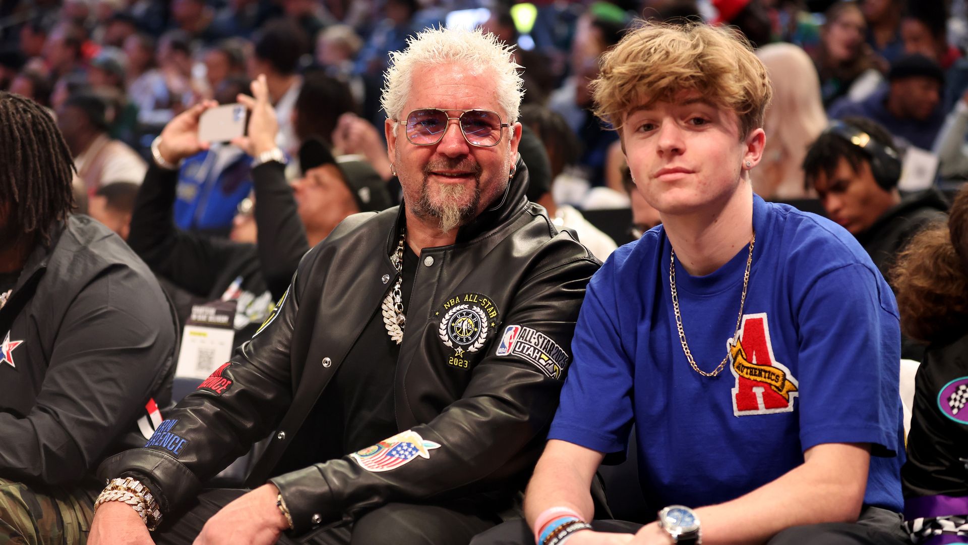 Guy Fieri poses with his son Ryder Fieri prior to the 2023 NBA All Star Game between Team Giannis and Team LeBron at Vivint Arena on February 19, 2023 in Salt Lake City, Utah