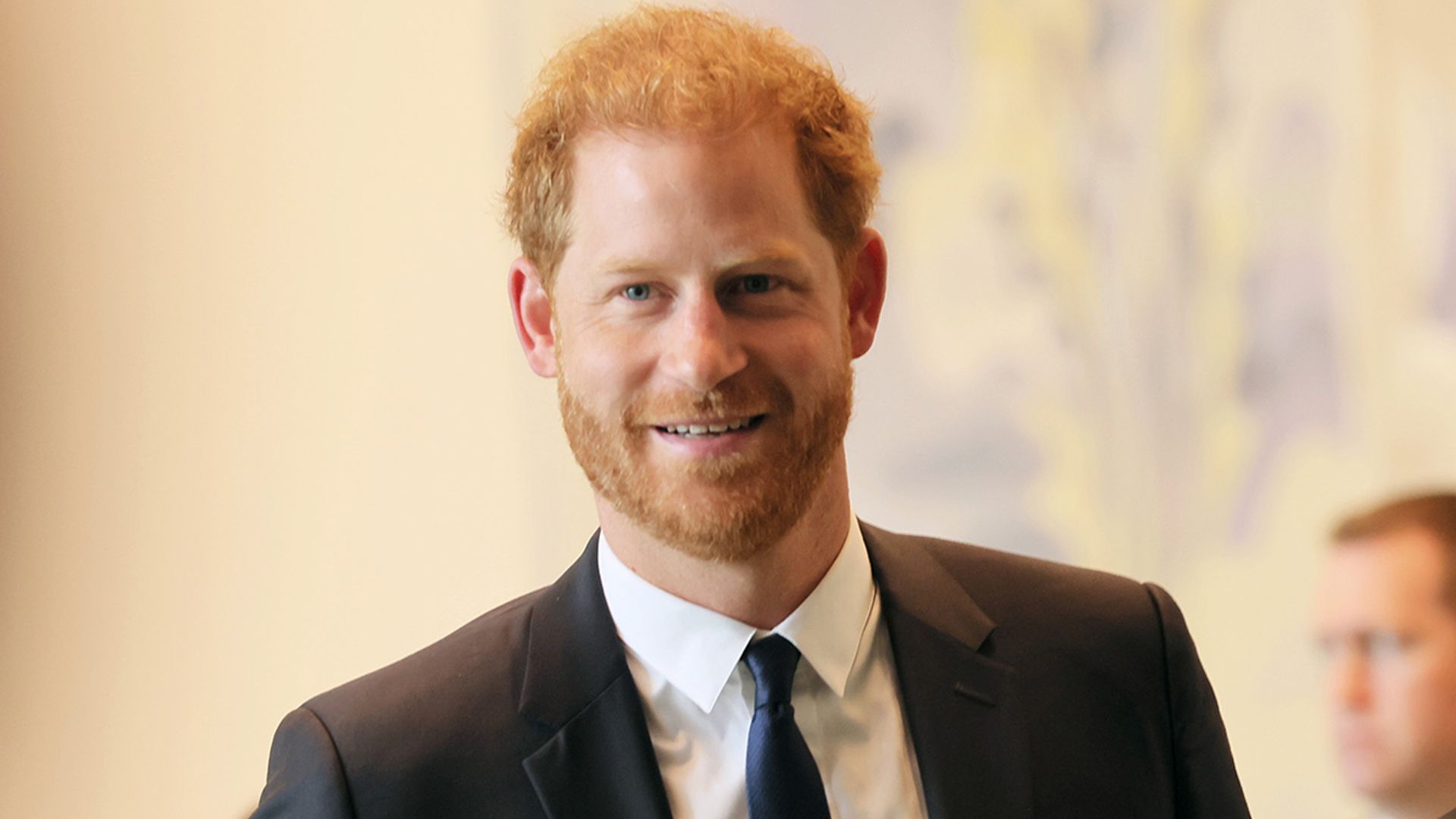 prince harry smiling in suit