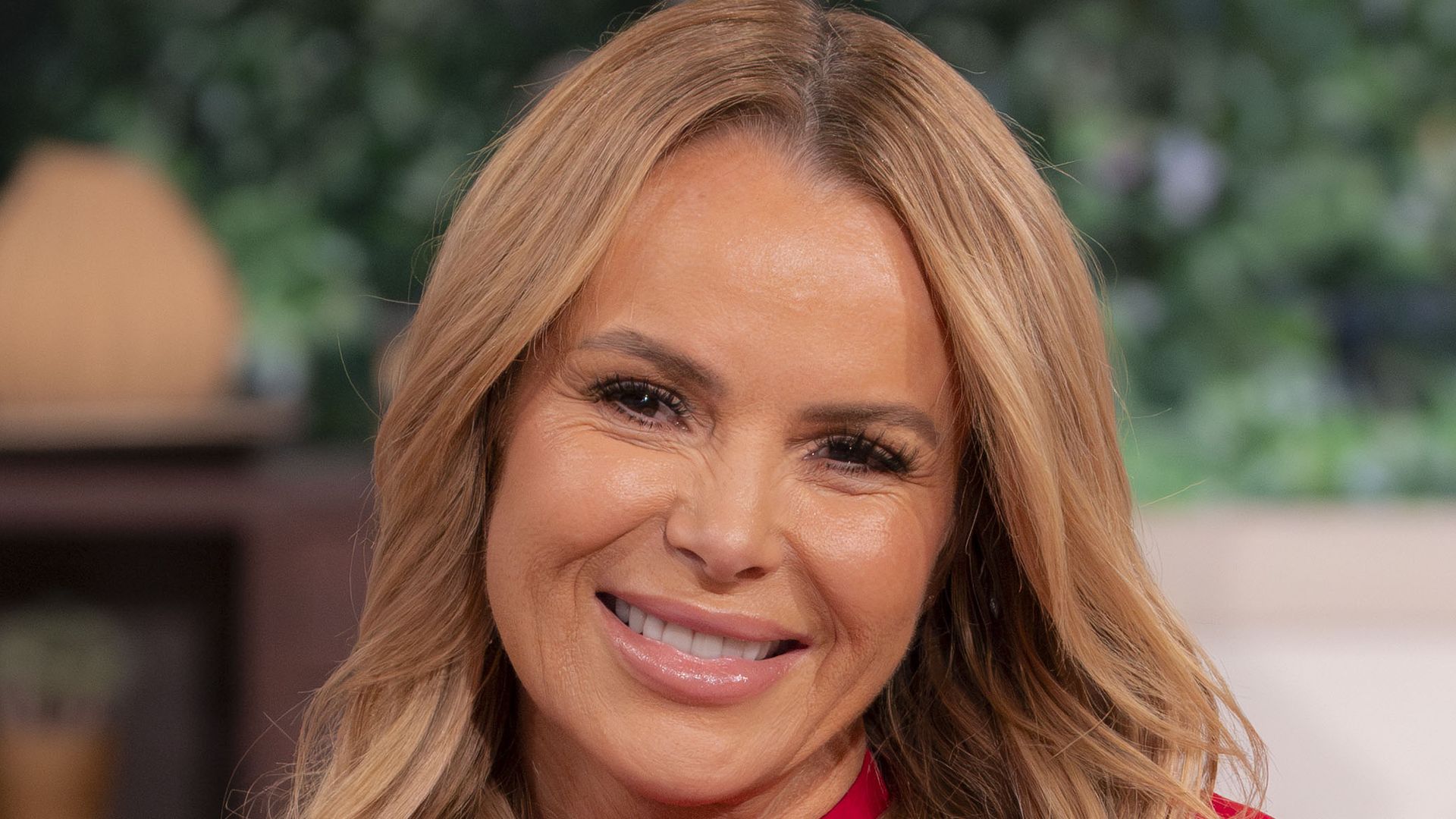 Amanda Holden on This Morning sofa in red dress