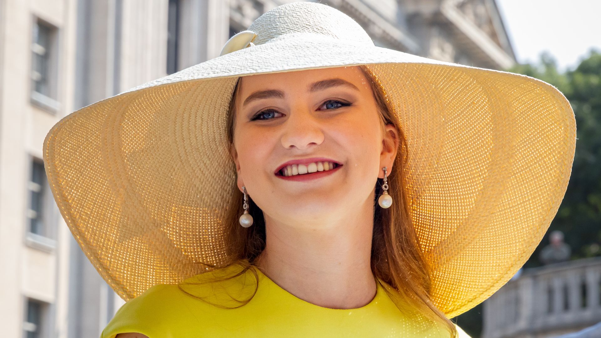 Princess Elisabeth wearing yellow dress and sun hat