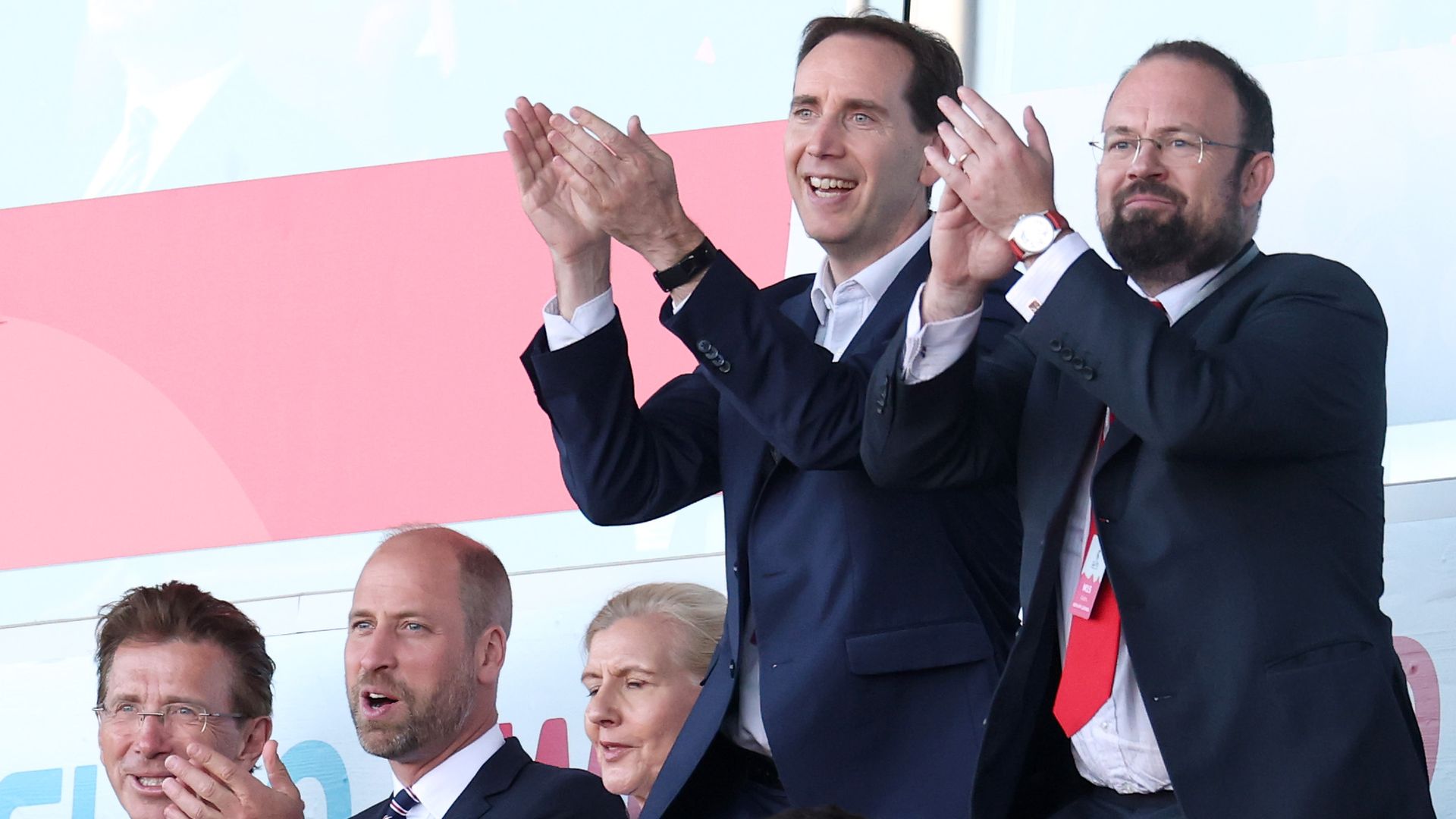 Prince William applauding, others around him are more excited