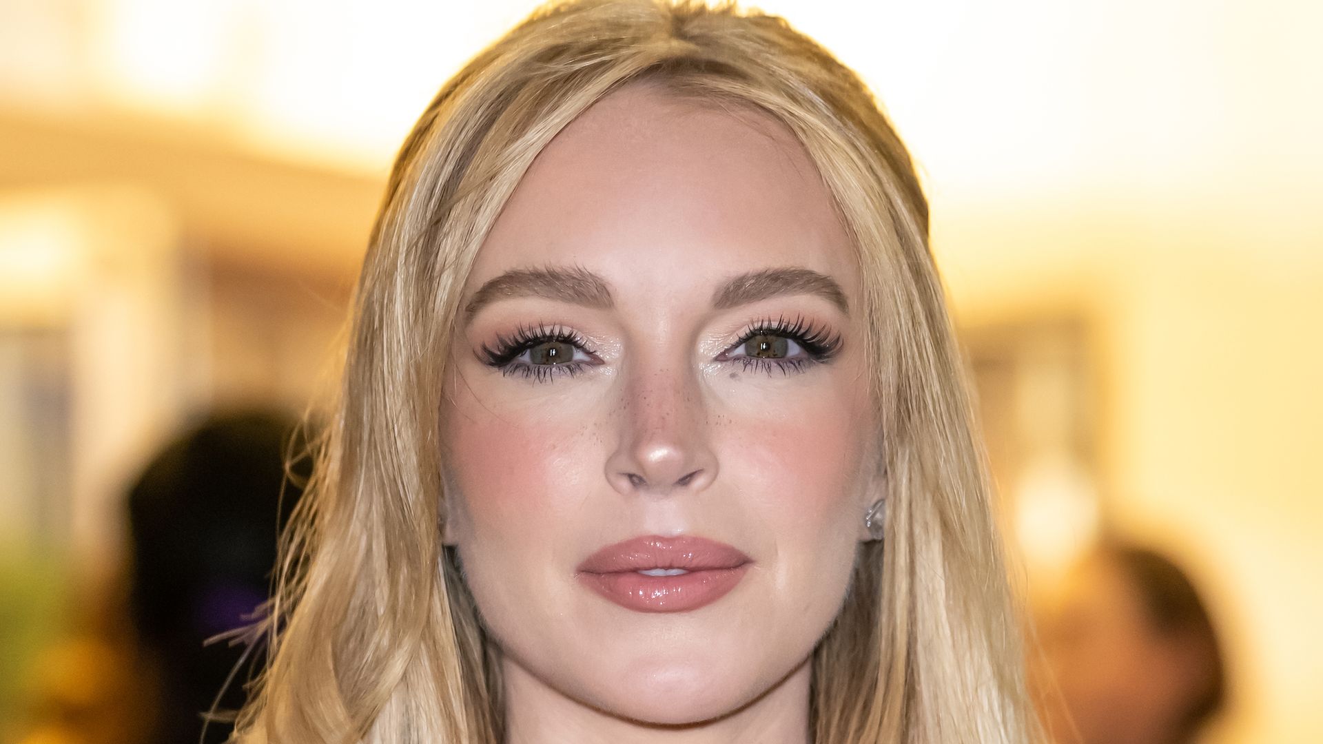 Lindsay Lohan is seen arriving to the screening of Netflix's "Our Little Secret" at The Paris Theatre on November 18, 2024 in New York City