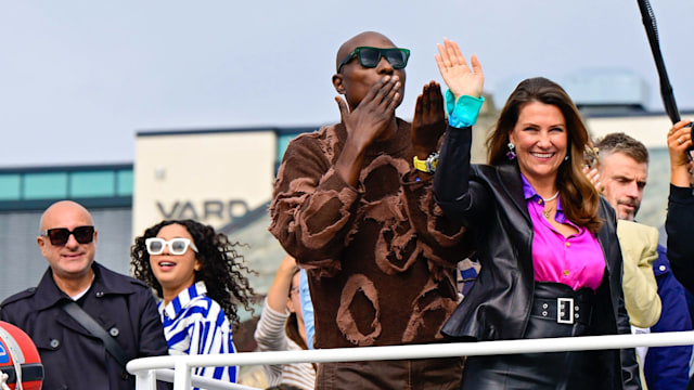 Durek Verrett blows a kiss from boat while Martha Louise waves