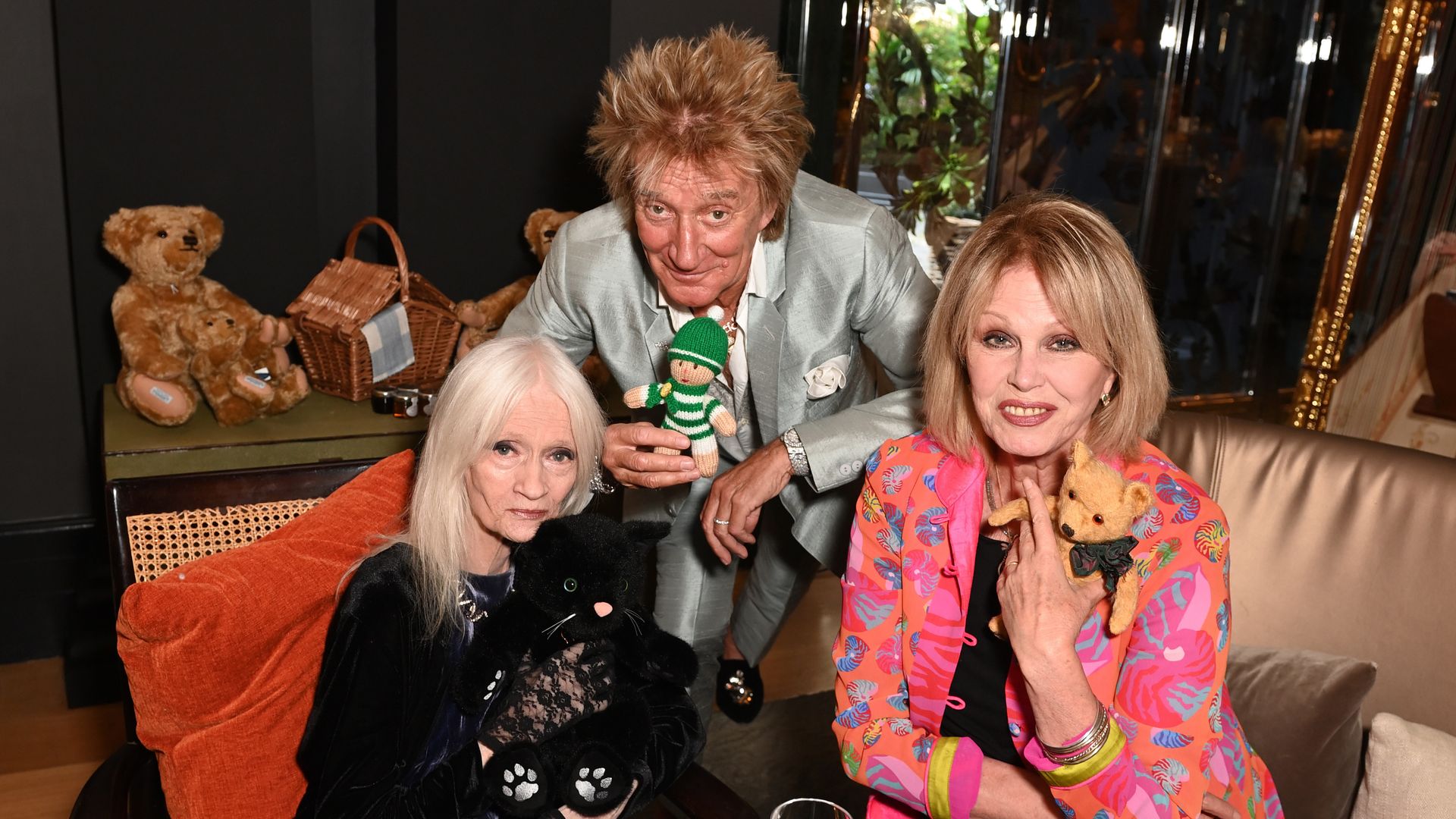 Celia Hammond wears black as she joins Rod Stewart in a silver suit and Joanna Lumley