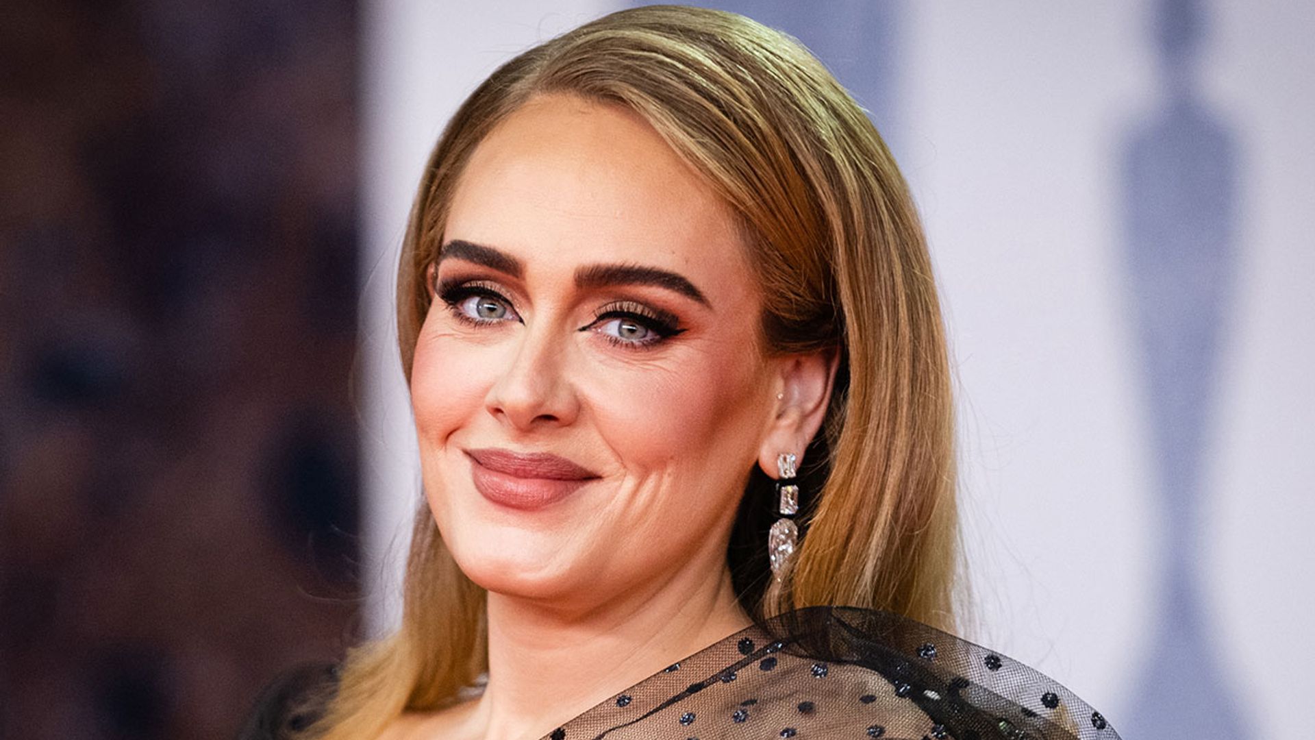 Adele stuns in black mini dress as she marks 34th birthday with makeup