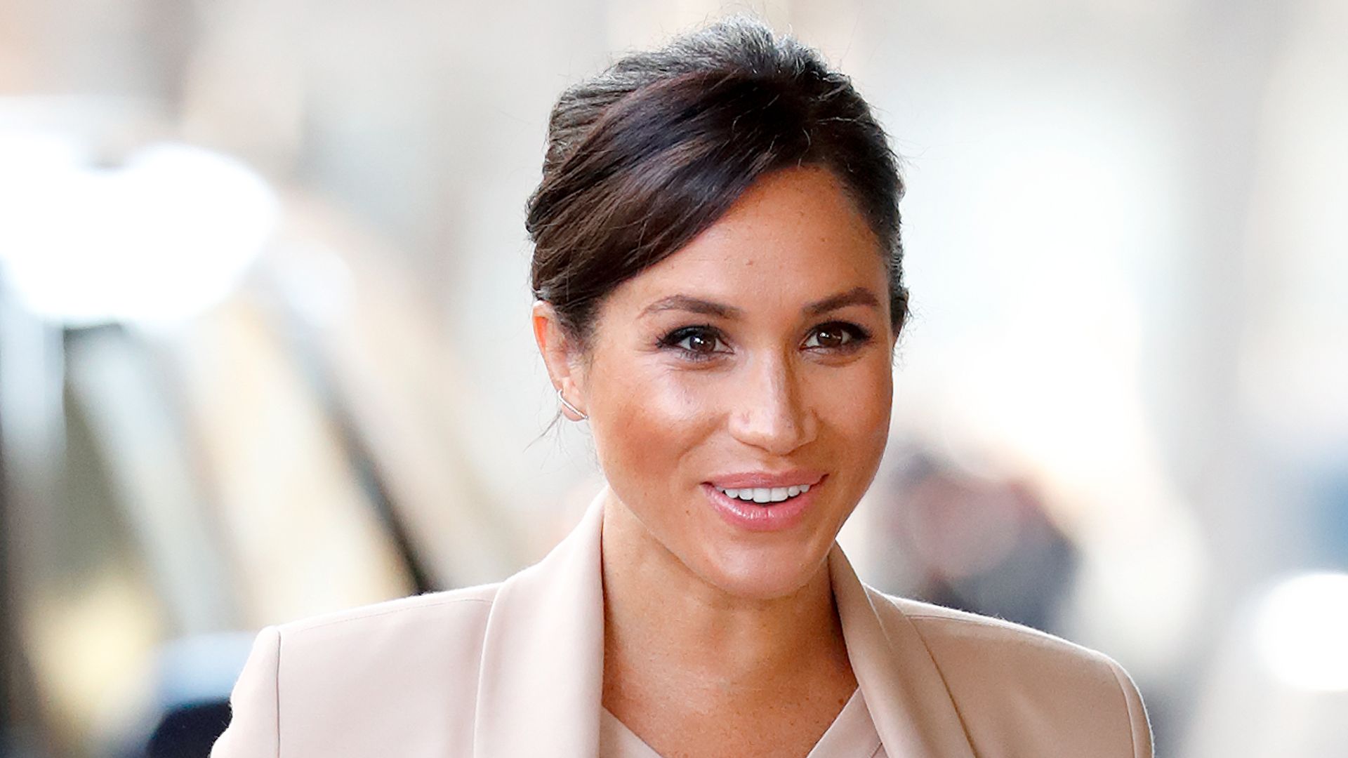 Meghan Markle wears pink beige blazer and dress in 2019 to visit The National Theatre