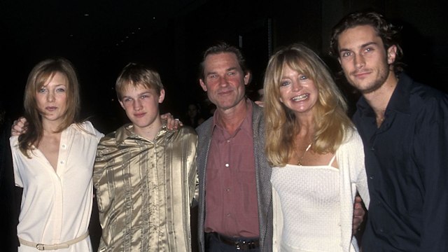 Musician Chris Robinson of the Black Crows, actress Kate Hudson, Wyatt Russell, actor Kurt Russell, actress Goldie Hawn and actor Oliver Hudson attend the Hollywood Women's Press Club's 60th Annual Golden Apple Awards on December 10, 2000 at Beverly Hilton Hotel in Beverly Hills, California