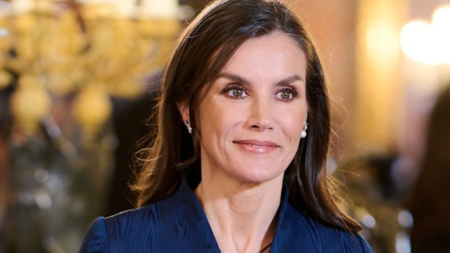 Queen Letizia wearing navy dress and sapphire necklace