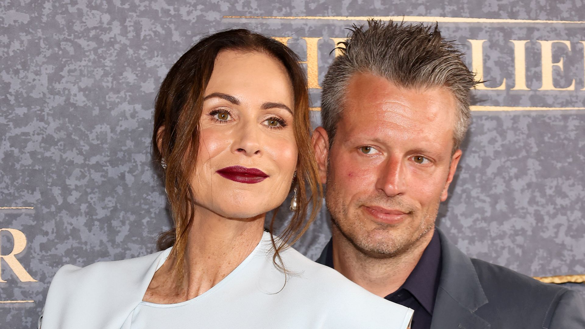 minnie driver addison o'dea hugging red carpet