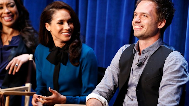 Meghan Markle smiling at Patrick J. Adams 