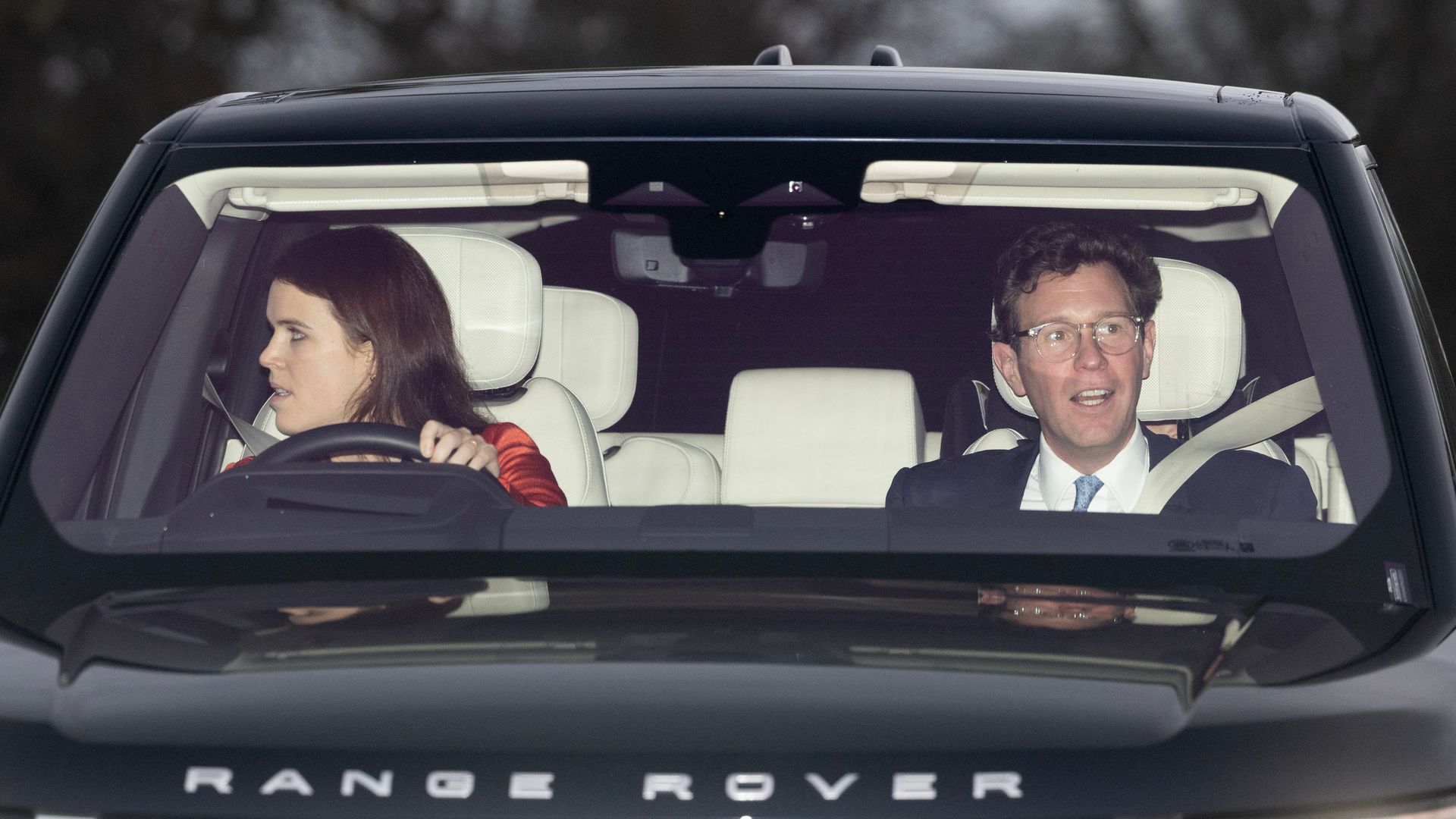 Princess Eugenie driving a black Range Rover with Jack Brooksbank