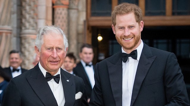 King Charles and Prince Harry smiling 