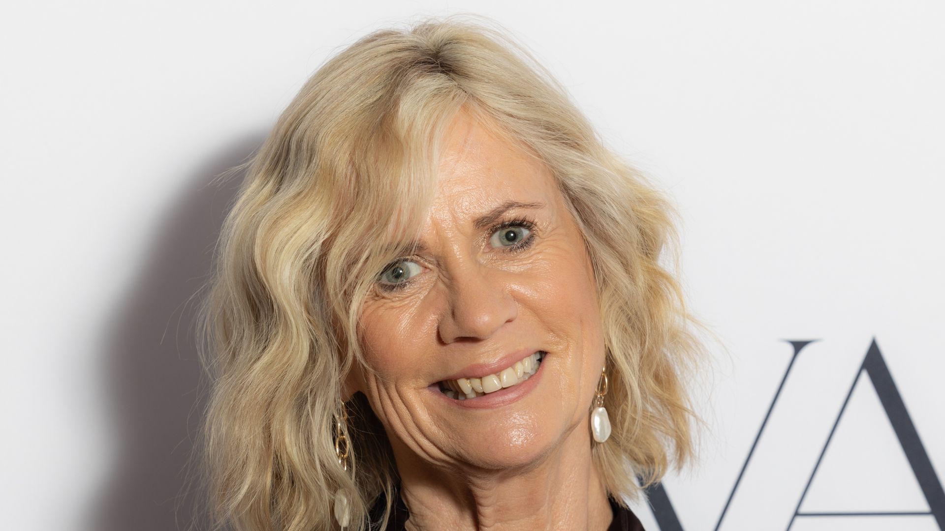 blonde woman in smart shirt 