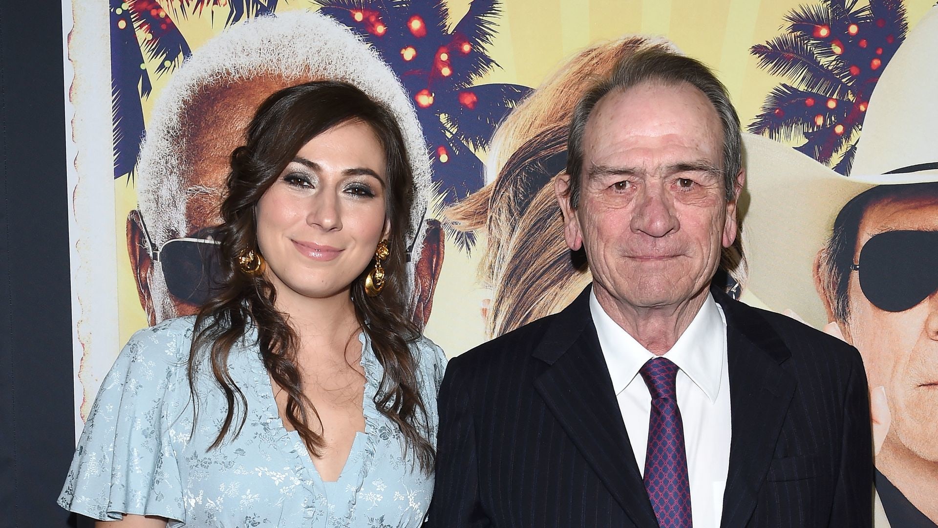 Tommy Lee Jones in suit and daughter Victoria Jones in blue dress  arrive at the premiere of 'Just Getting Started' at ArcLight Hollywood 