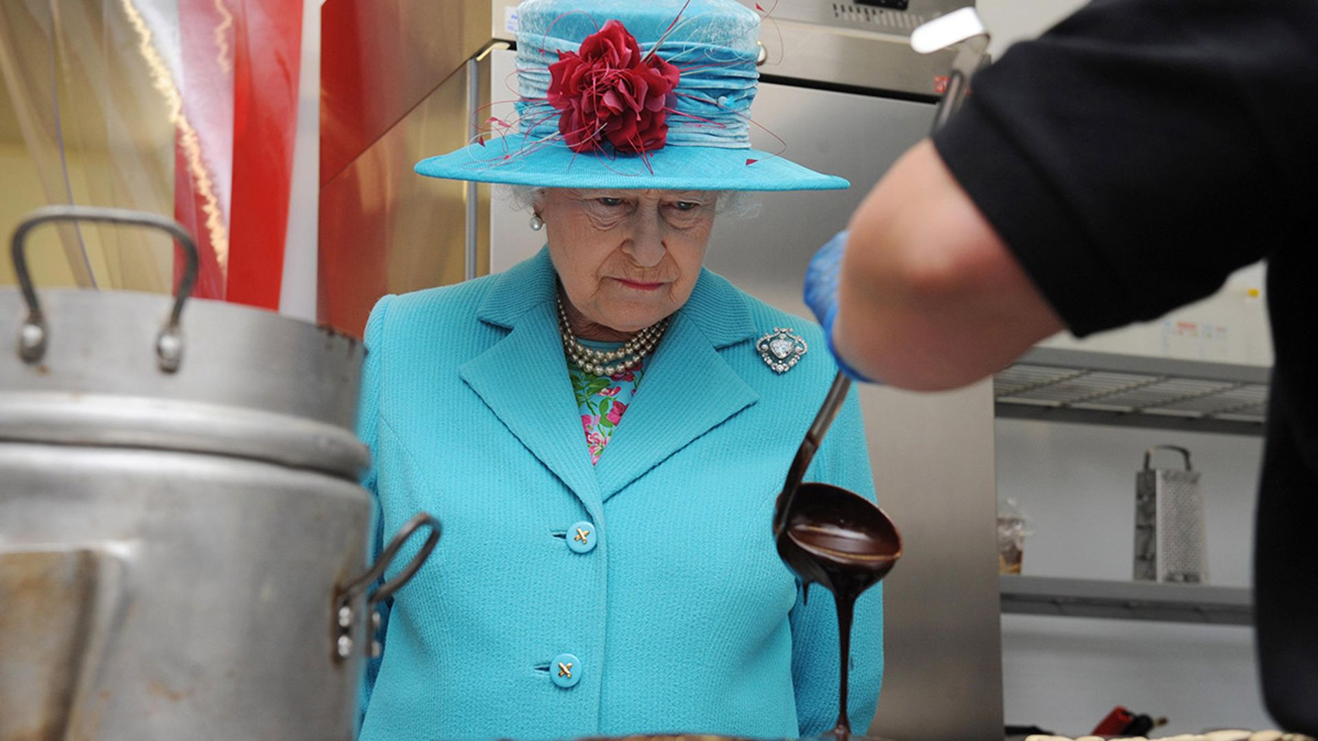 the queen looking at food 