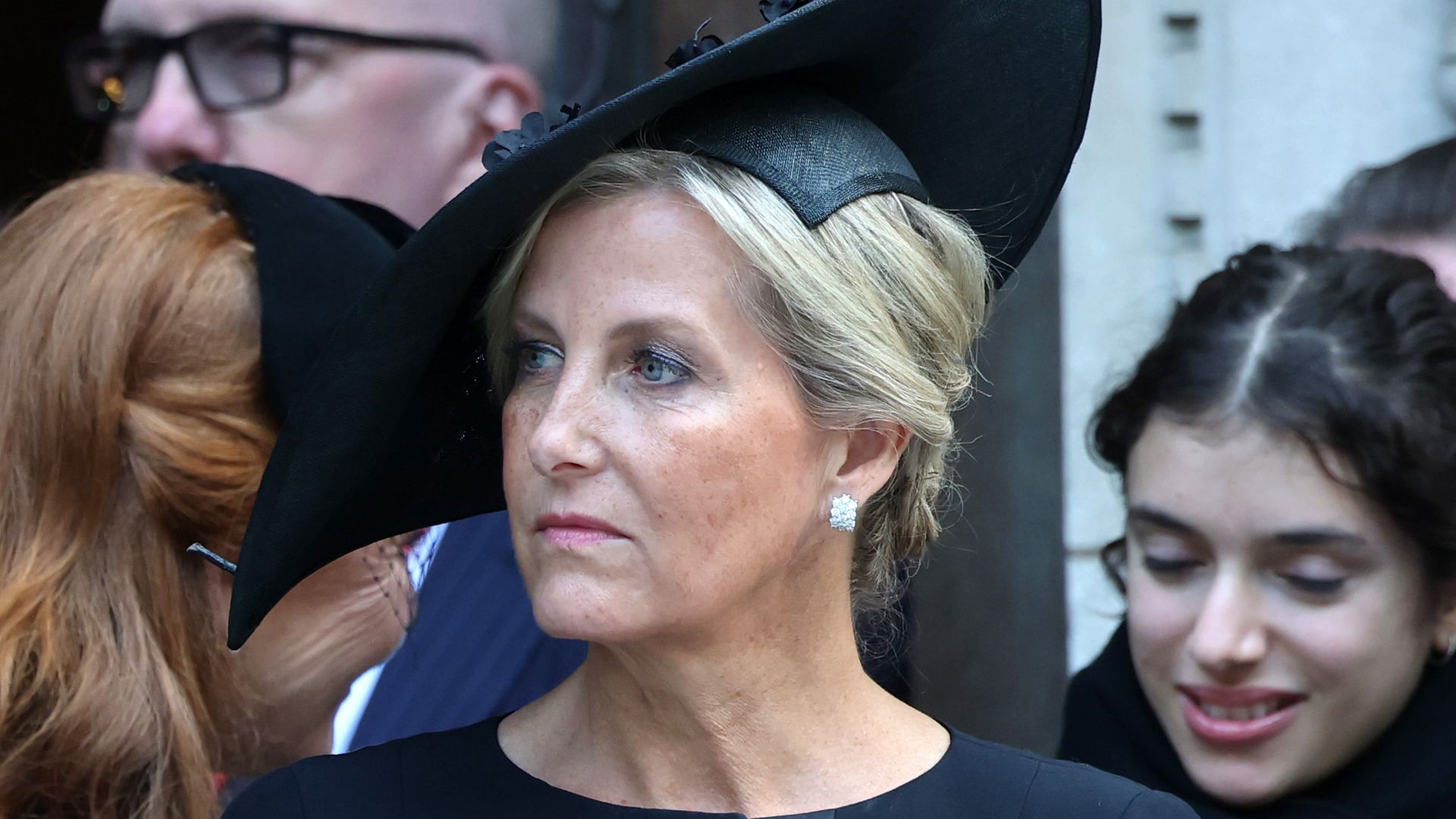 The Duchess of Edinburgh in a black dress at a funeral