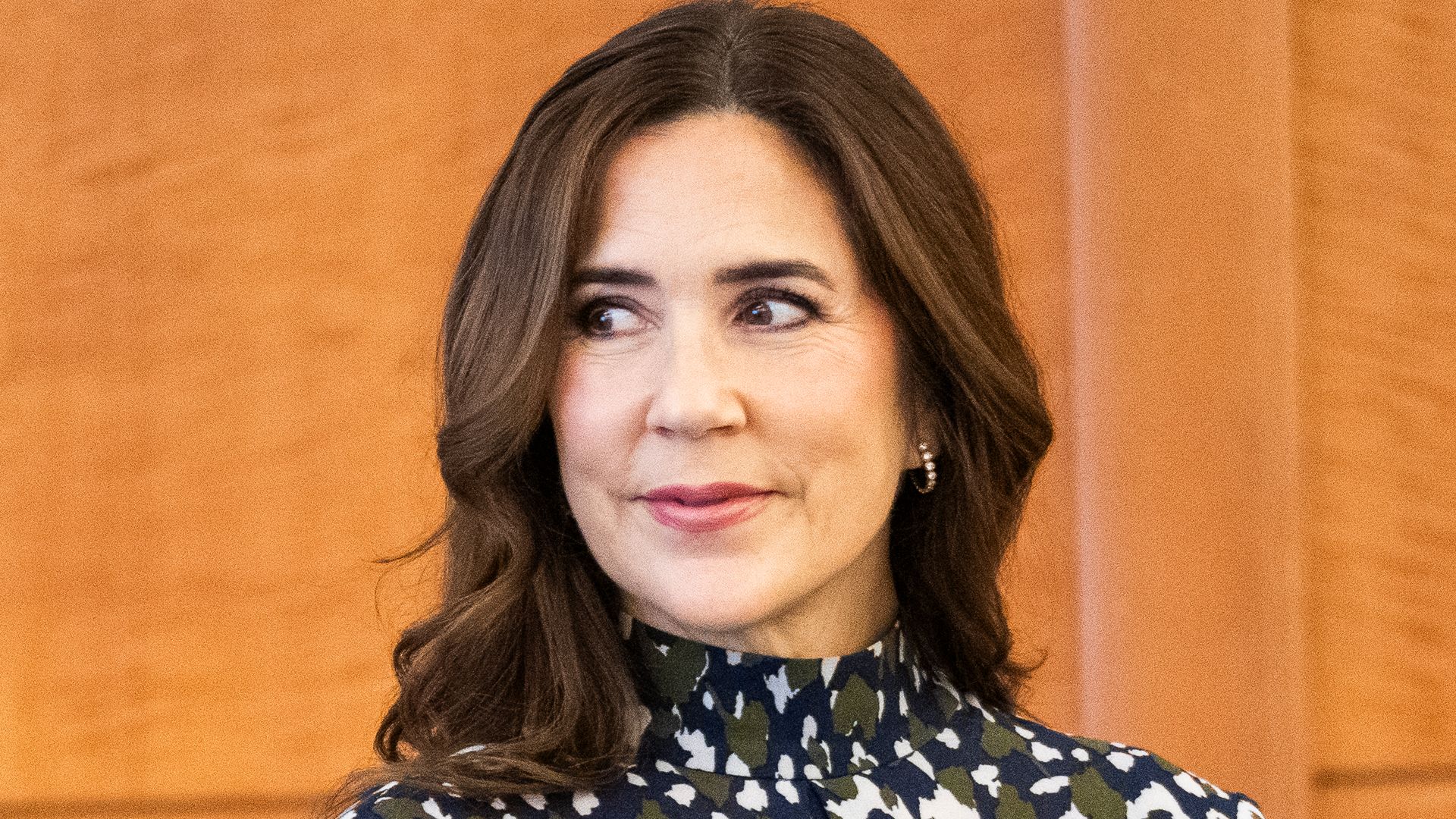 Queen Mary of Denmark's hair looks lighter than ever as she poses in silky leopard print skirt