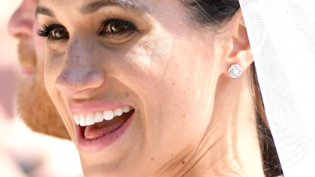 Meghan, Duchess of Sussex leaves Windsor Castle in the Ascot Landau carriage during a procession after getting married at St Georges Chapel on May 19, 2018 in Windsor, England