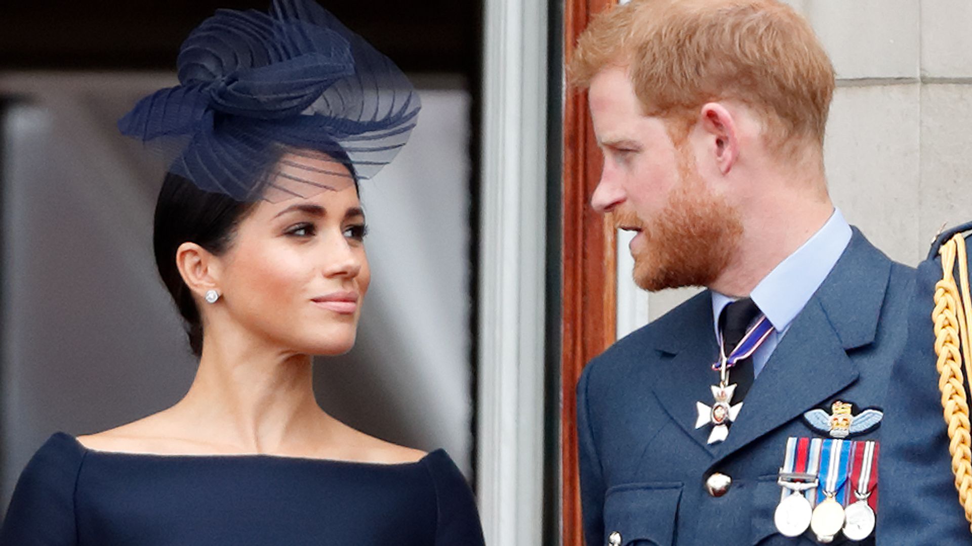 The Duke and Duchess of Sussex looking at each other on the balcony of Buckingham Palace on July 10, 2018