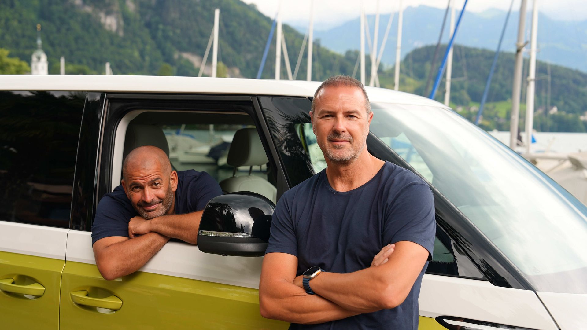 TX DATE:29-09-2024,TX WEEK:40,EMBARGOED UNTIL:24-09-2024,DESCRIPTION:Chris and Paddy with their electric vehicle at Vitznau Harbour,COPYRIGHT:BBC Studios,CREDIT LINE:BBC/BBC Studios