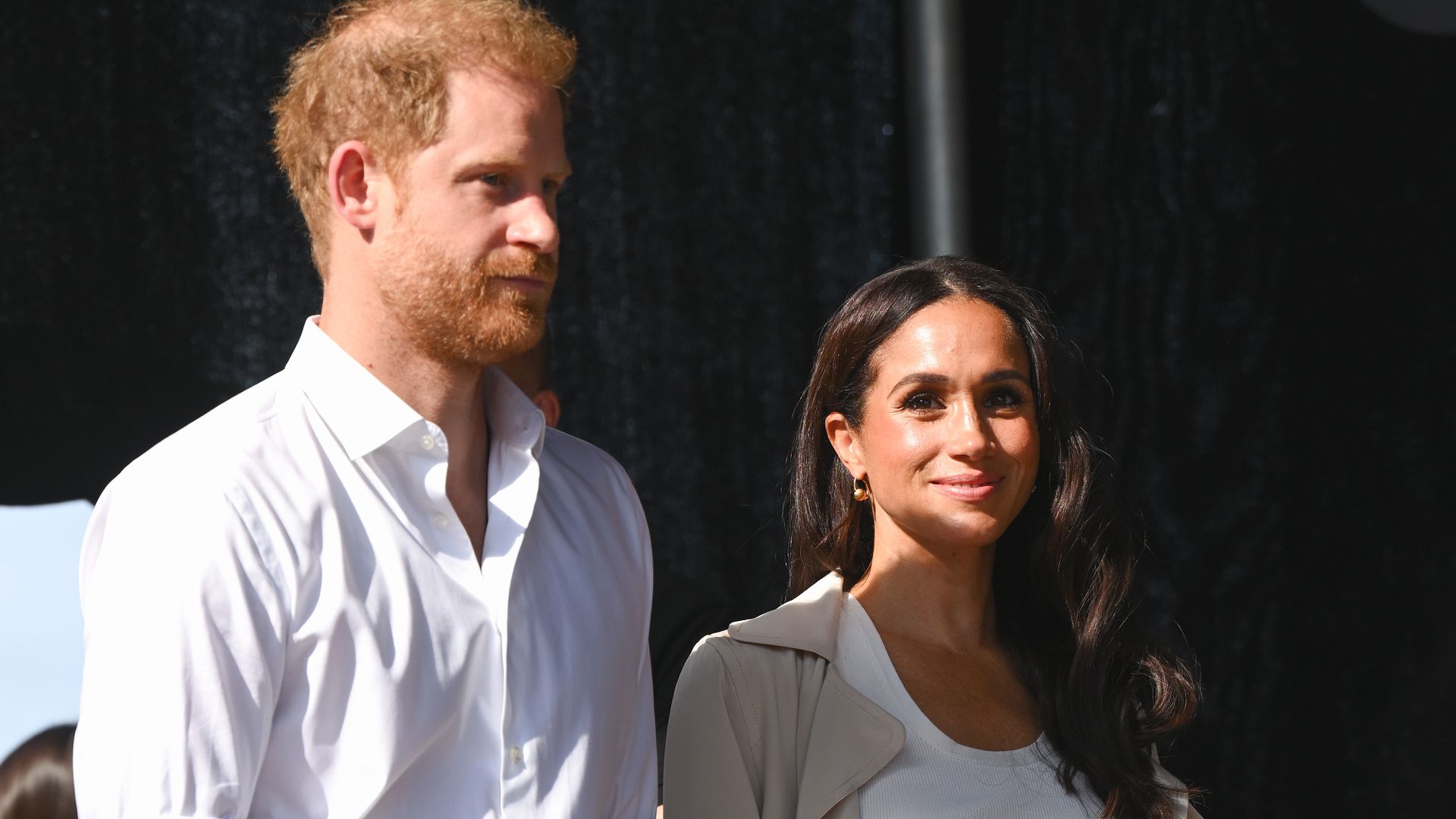 prince harry and meghan in cropped trousers at invictus games 