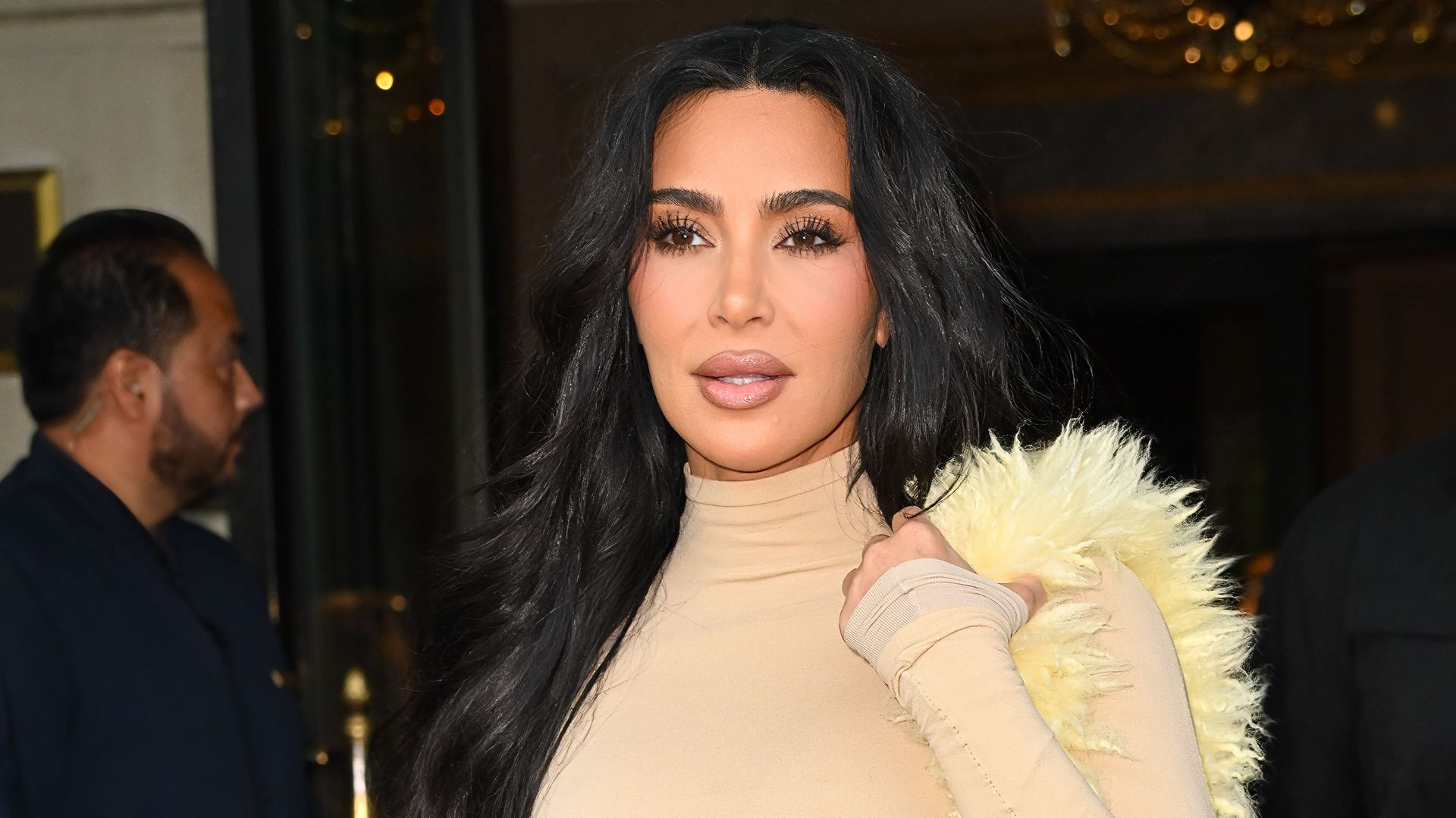 Kim Kardashian's bodycon dress and boots look is giving us major autumn fashion inspo