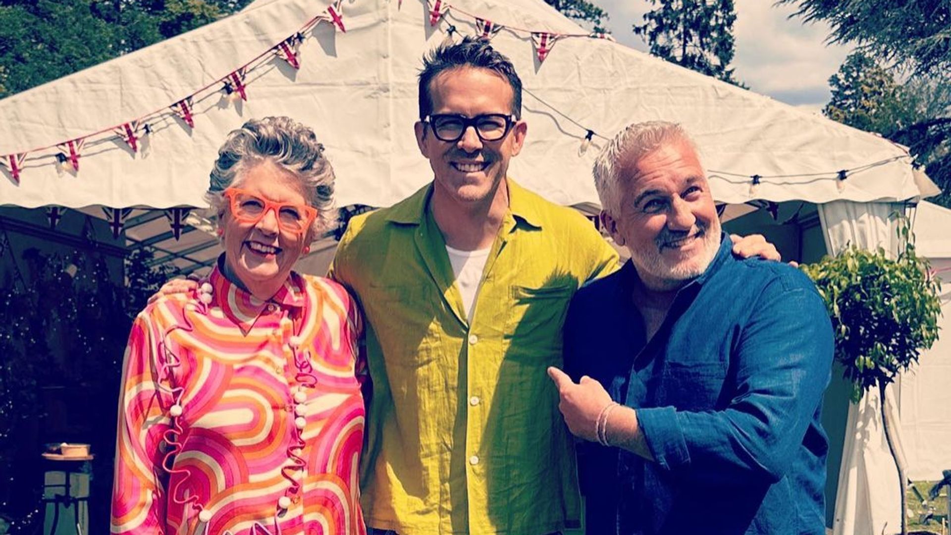 Ryan Reynolds poses with Prue Leith (left) and Paul Hollywood