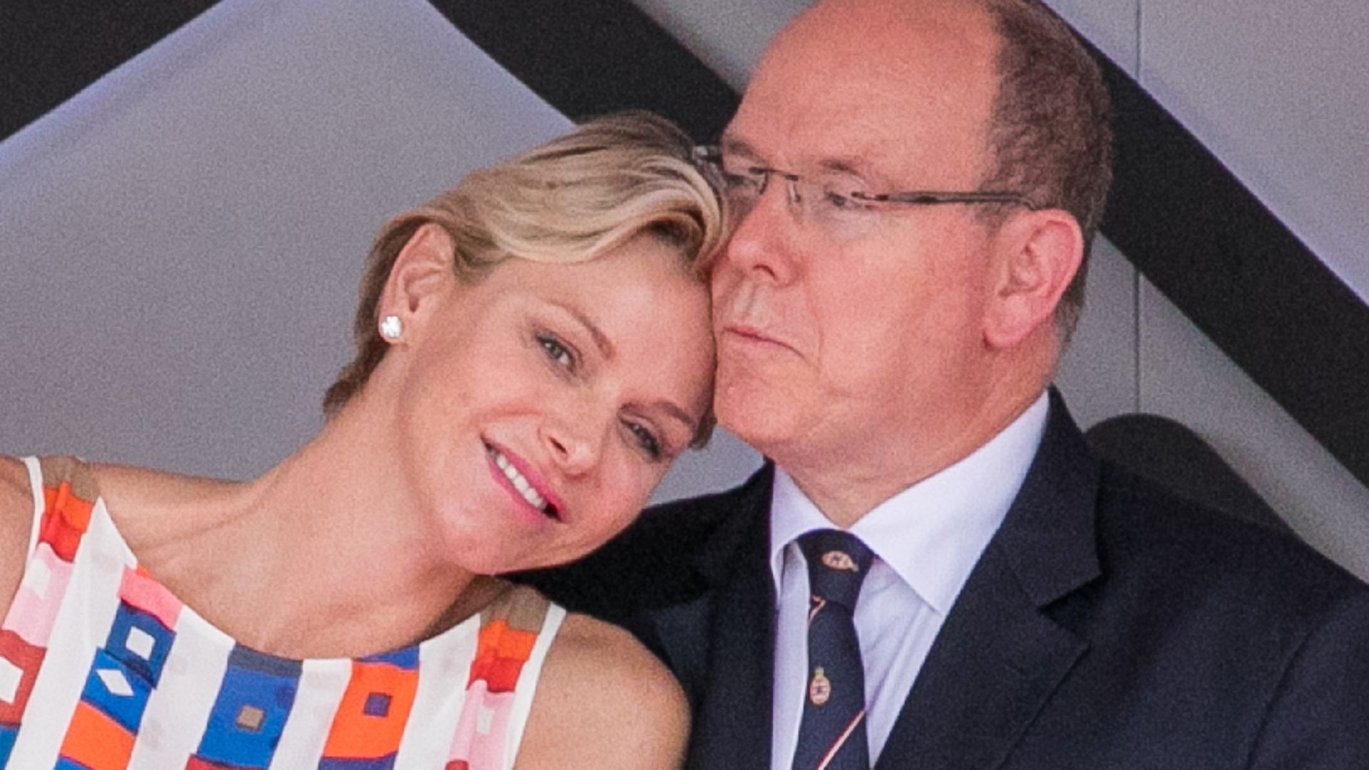 Princess Charlene leaning in for a cuddle with husband Prince Albert
