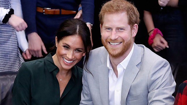 prince harry and meghan markle smiling sussex