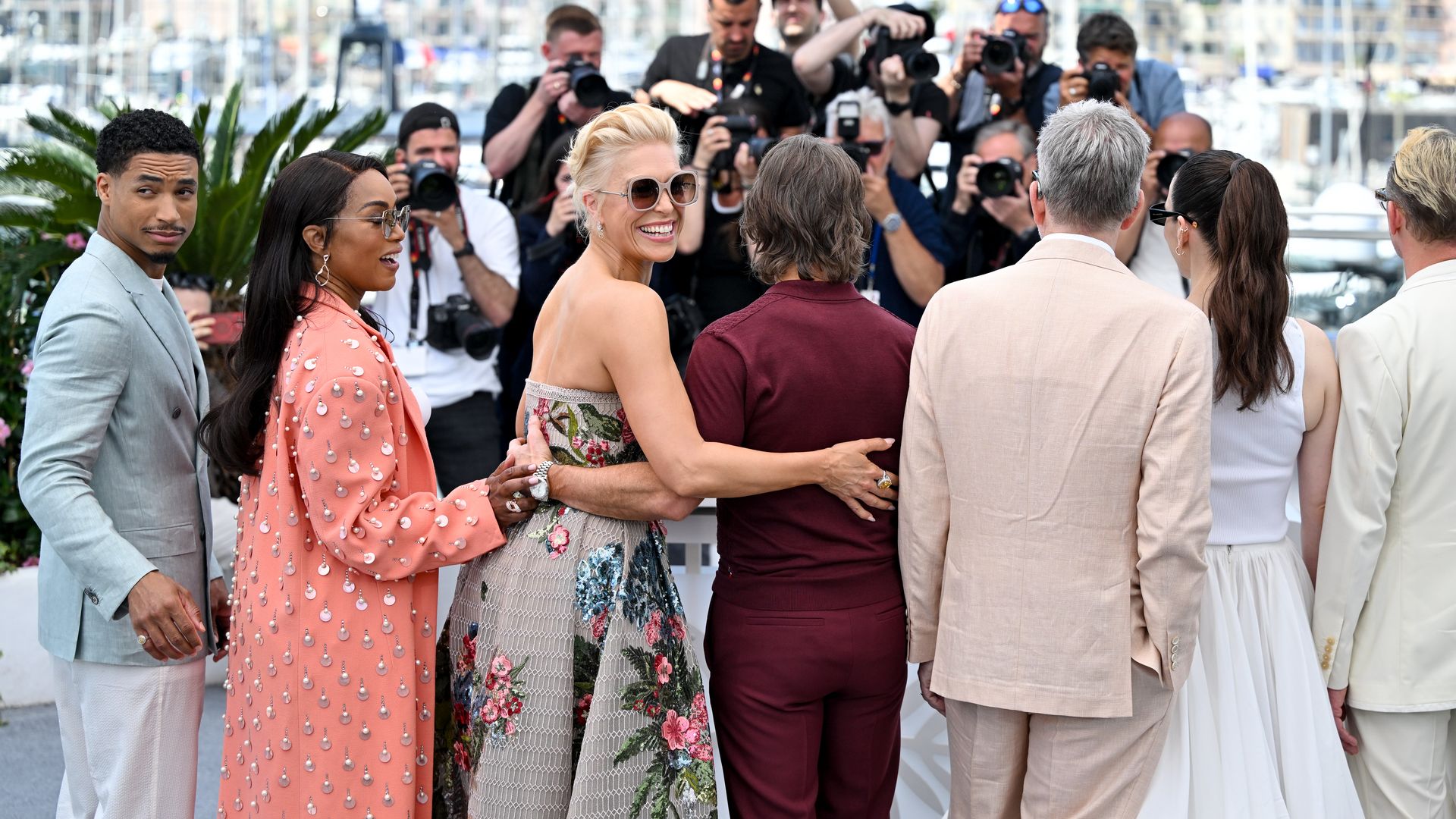Greg Tarzan Davis, Angela Bassett, Hannah Waddingham and Tom Cruise standing in a line; Hannah Waddingham has her arm on Tom Cruise's back