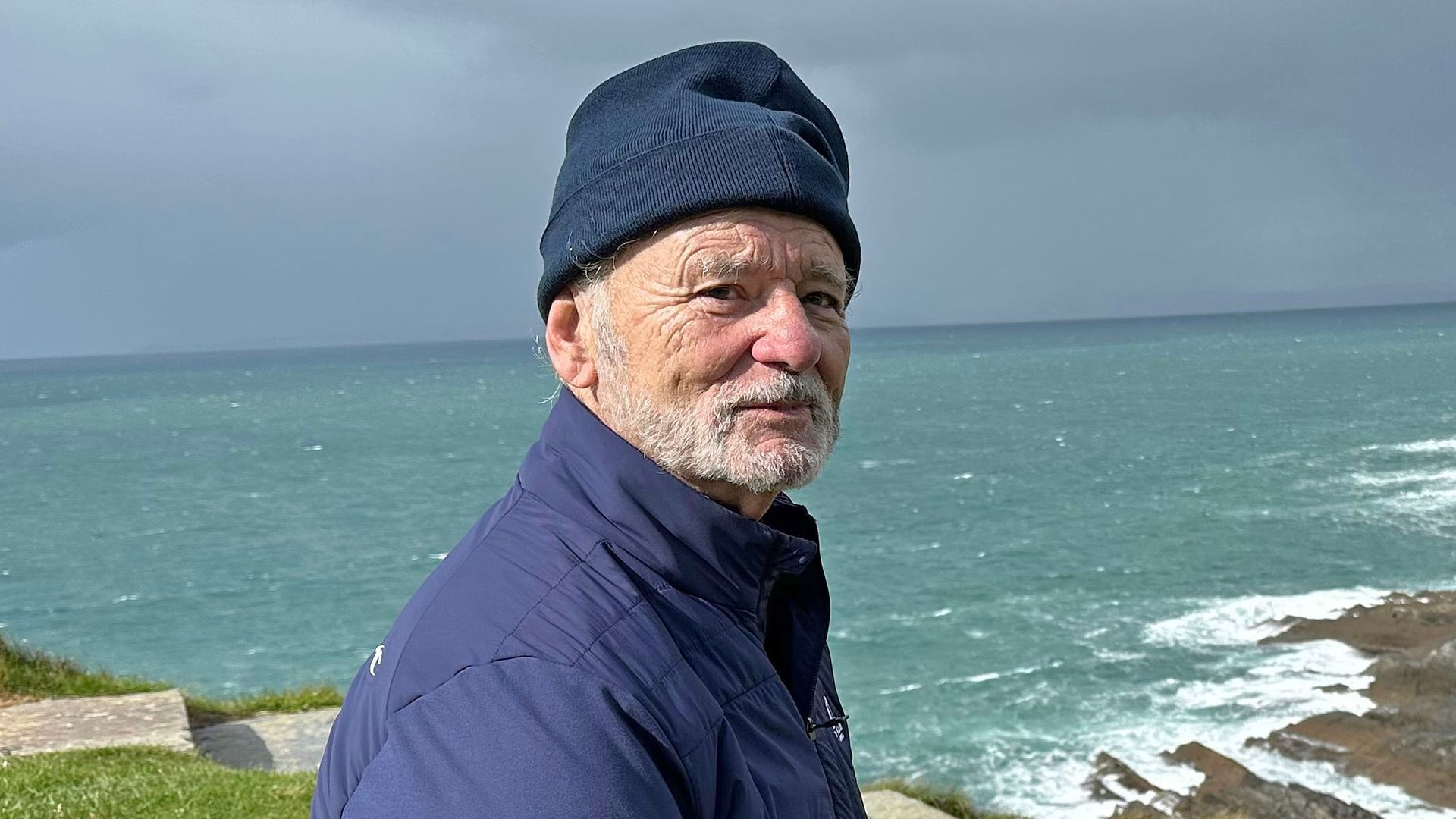 Bill Murray in Ireland sitting near a golf course