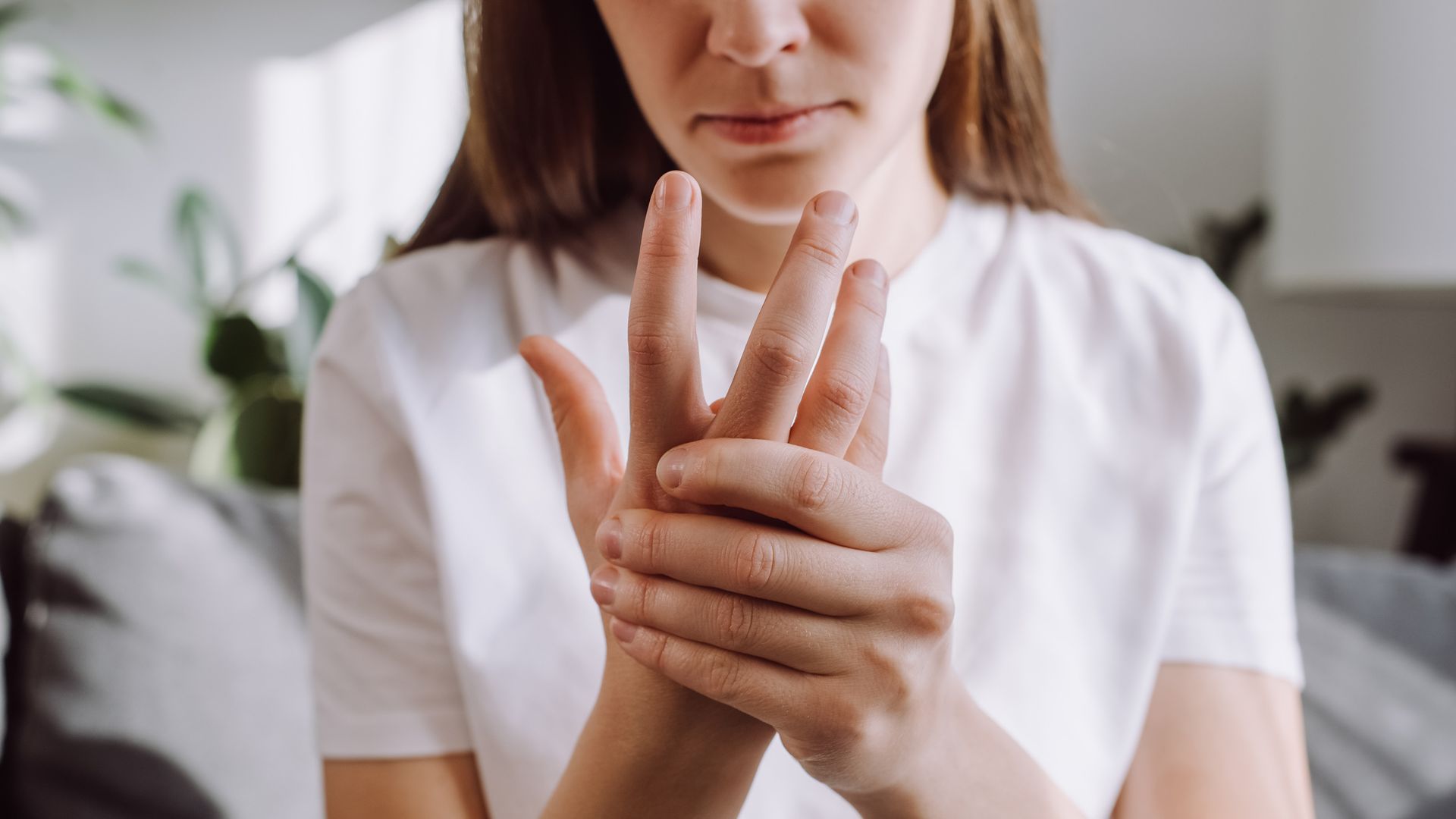 woman worried about her hands tingling arthritis