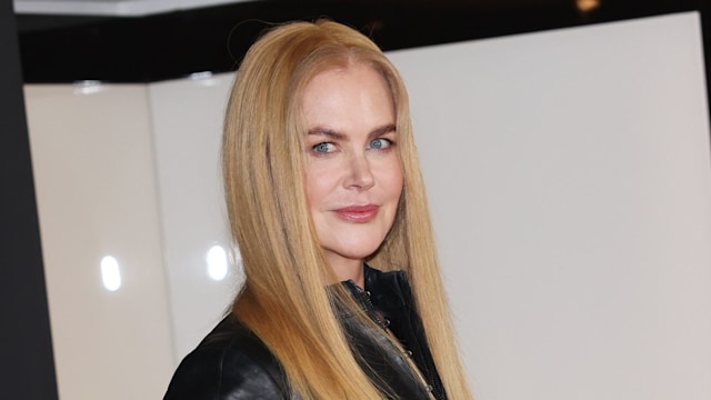 A close up of Nicole Kidman's long straight blonde hair, glossy radiant skin and pink lips