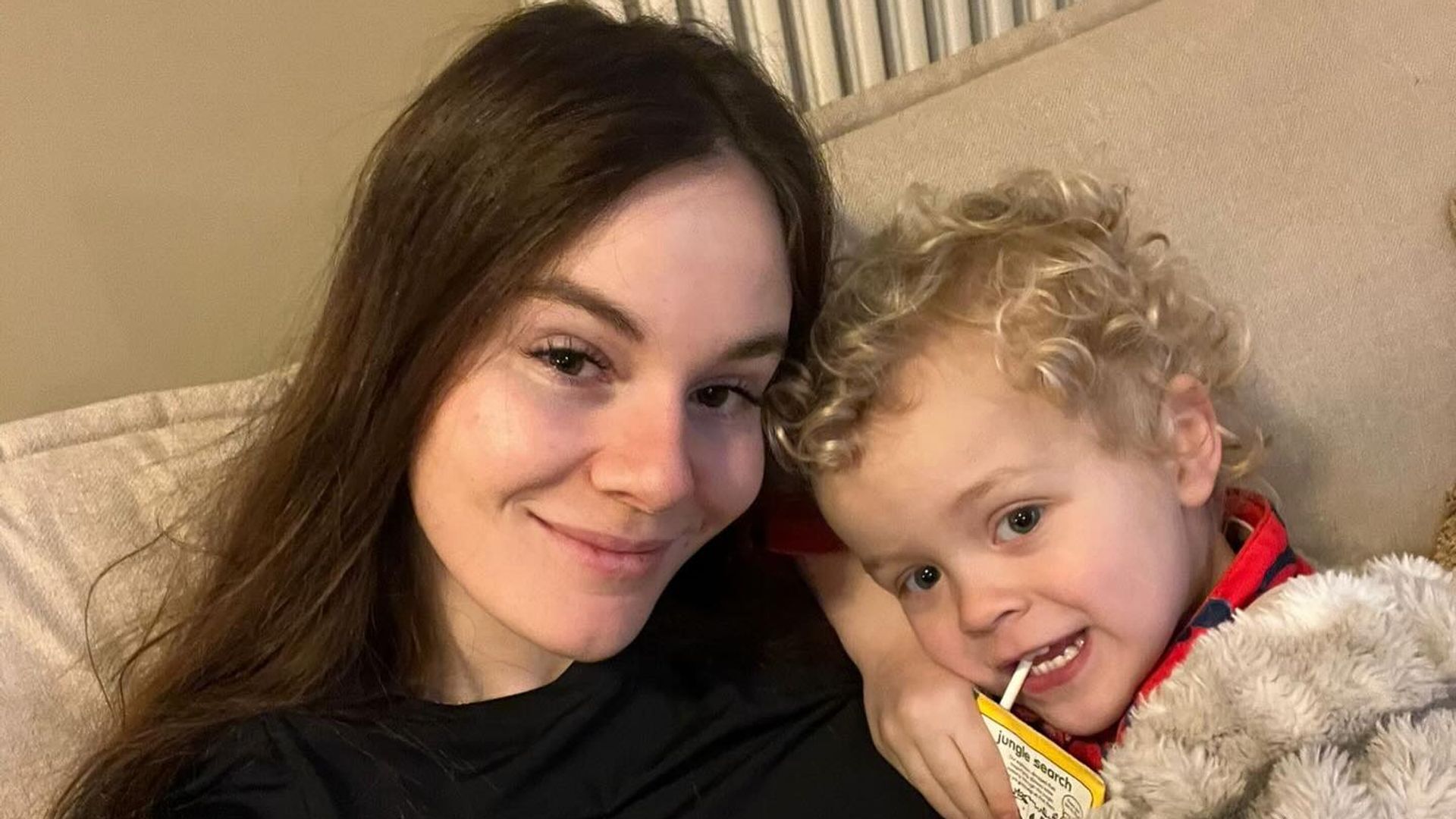 Holly ramsay and stepson George on sofa cuddle