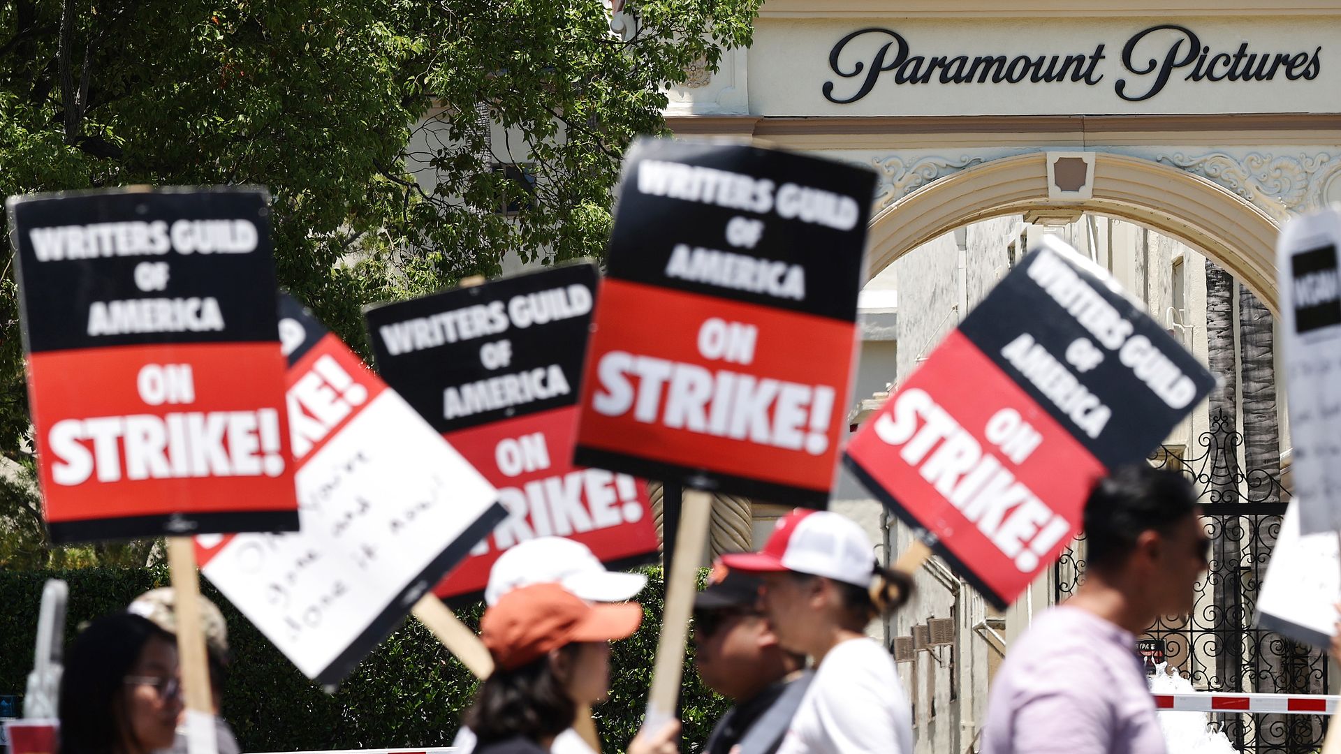 Workers of the Writers Guild of America (WGA) strike outside Paramount Studios on July 12, 2023 in Los Angeles, California