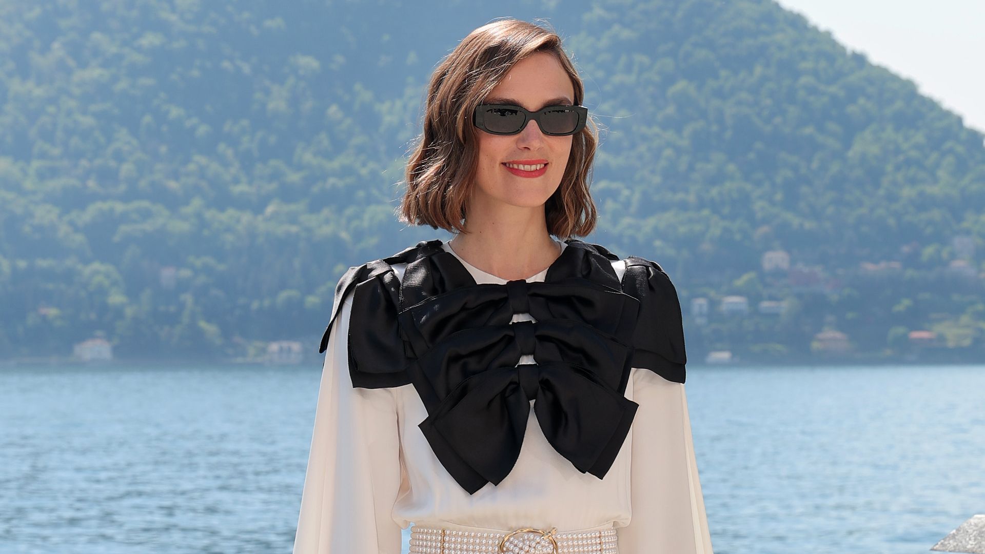 Keira Knightley attends the Chanel Cruise 2025 fashion show in a white maxi gown