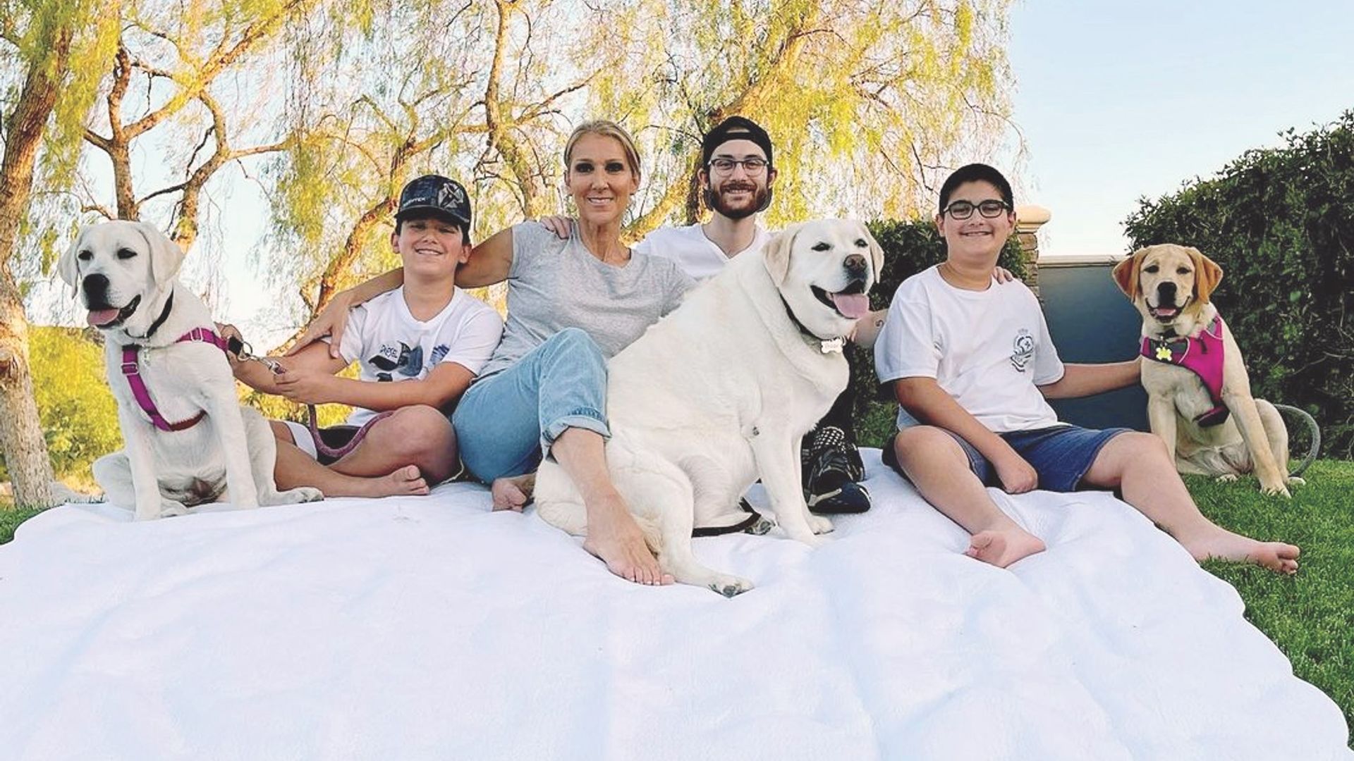 Celine Dion, her boys, and their dogs in happier times.