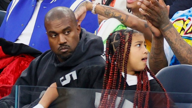 North and Kanye West at a basketball match