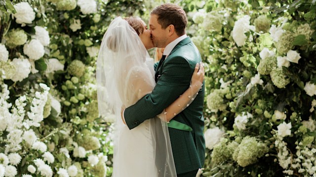 Faye Harris and Tyrone Wood kissing on their wedding day